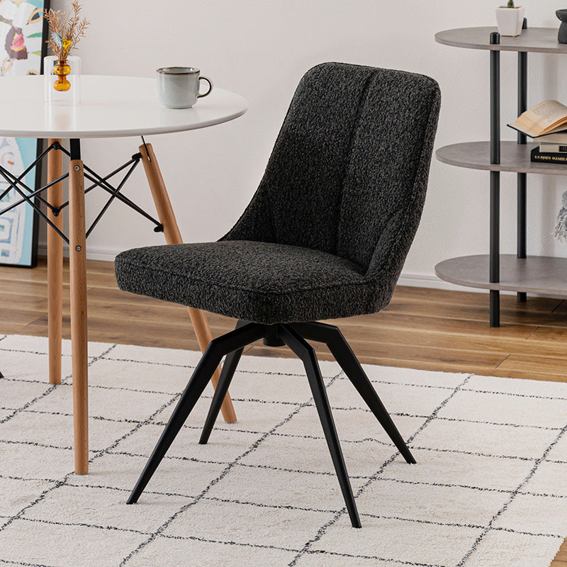 立体的で動きのあるファブリックを使用した回転アームチェア