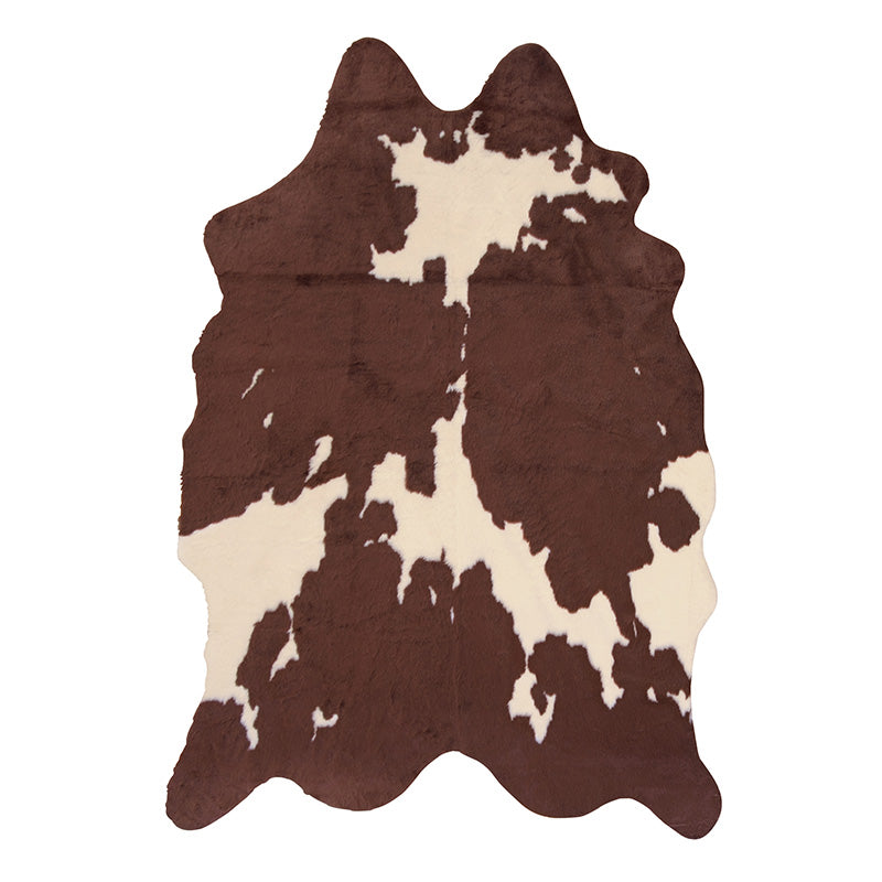 フェイクファーを使用したカウ柄のラグ