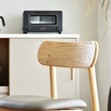 やわらかな曲線が温かみを添えるアッシュ無垢材のダイニングチェア