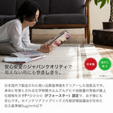アクセント色と非対称パターンが優しい表情のチェック柄ラグ